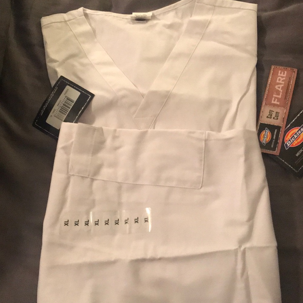 I have 2 sets of NWT Cherokee XL scrubs